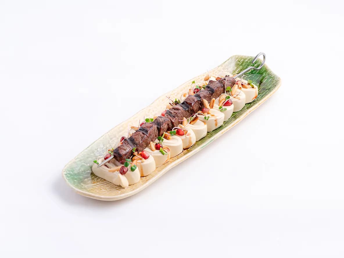 حمص بالواغيو والمكسرات at Aram Restaurant